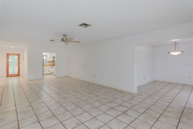 Tucked beneath the shade of moss-draped oaks and overlooking on Tarpon Woods Golf Club in Florida - for sale on GolfHomes.com, golf home, golf lot