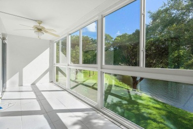Best priced unit with impact windows! Stunning waterfront 2 on Wynmoor Golf Course in Florida - for sale on GolfHomes.com, golf home, golf lot