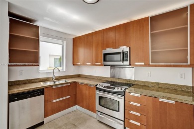 MOTIVATED SELLER!! Rare Bayfront Townhome with 30ft Boat Dock in on Normandy Shores Golf Course in Florida - for sale on GolfHomes.com, golf home, golf lot