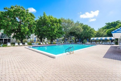 Best priced unit with impact windows! Stunning waterfront 2 on Wynmoor Golf Course in Florida - for sale on GolfHomes.com, golf home, golf lot
