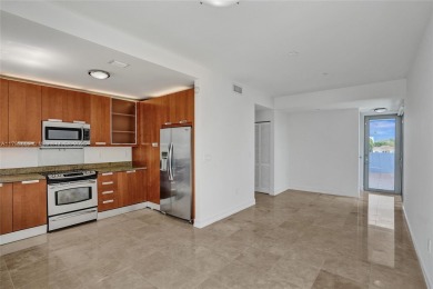 MOTIVATED SELLER!! Rare Bayfront Townhome with 30ft Boat Dock in on Normandy Shores Golf Course in Florida - for sale on GolfHomes.com, golf home, golf lot