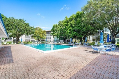Best priced unit with impact windows! Stunning waterfront 2 on Wynmoor Golf Course in Florida - for sale on GolfHomes.com, golf home, golf lot