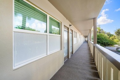 Best priced unit with impact windows! Stunning waterfront 2 on Wynmoor Golf Course in Florida - for sale on GolfHomes.com, golf home, golf lot
