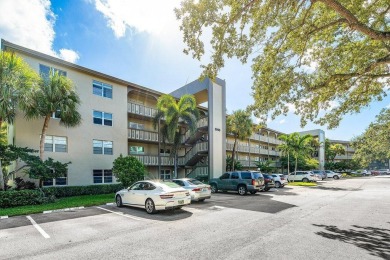 Best priced unit with impact windows! Stunning waterfront 2 on Wynmoor Golf Course in Florida - for sale on GolfHomes.com, golf home, golf lot