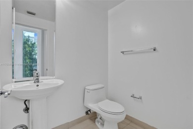 MOTIVATED SELLER!! Rare Bayfront Townhome with 30ft Boat Dock in on Normandy Shores Golf Course in Florida - for sale on GolfHomes.com, golf home, golf lot