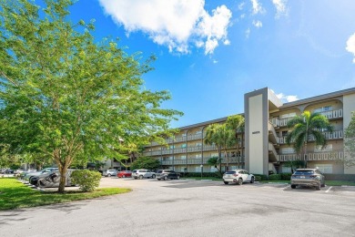Best priced unit with impact windows! Stunning waterfront 2 on Wynmoor Golf Course in Florida - for sale on GolfHomes.com, golf home, golf lot