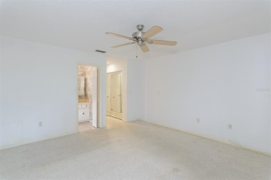 Tucked beneath the shade of moss-draped oaks and overlooking on Tarpon Woods Golf Club in Florida - for sale on GolfHomes.com, golf home, golf lot