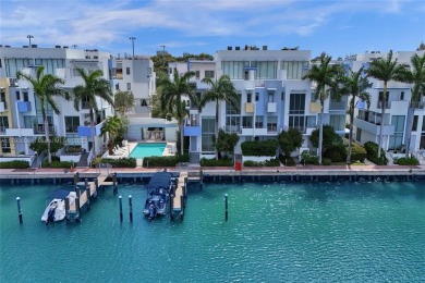 MOTIVATED SELLER!! Rare Bayfront Townhome with 30ft Boat Dock in on Normandy Shores Golf Course in Florida - for sale on GolfHomes.com, golf home, golf lot