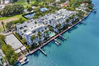 MOTIVATED SELLER!! Rare Bayfront Townhome with 30ft Boat Dock in on Normandy Shores Golf Course in Florida - for sale on GolfHomes.com, golf home, golf lot