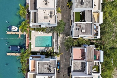 MOTIVATED SELLER!! Rare Bayfront Townhome with 30ft Boat Dock in on Normandy Shores Golf Course in Florida - for sale on GolfHomes.com, golf home, golf lot