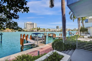 MOTIVATED SELLER!! Rare Bayfront Townhome with 30ft Boat Dock in on Normandy Shores Golf Course in Florida - for sale on GolfHomes.com, golf home, golf lot