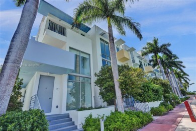 MOTIVATED SELLER!! Rare Bayfront Townhome with 30ft Boat Dock in on Normandy Shores Golf Course in Florida - for sale on GolfHomes.com, golf home, golf lot