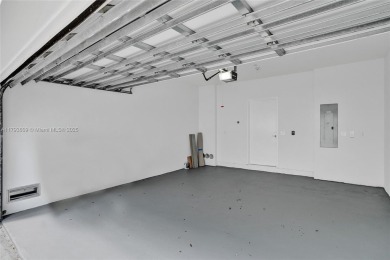 MOTIVATED SELLER!! Rare Bayfront Townhome with 30ft Boat Dock in on Normandy Shores Golf Course in Florida - for sale on GolfHomes.com, golf home, golf lot