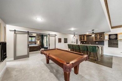 Welcome to this exceptional reverse 1.5-story walkout home in on Fred Arbanas Golf Course At Longview Lakes - Longview Lake in Missouri - for sale on GolfHomes.com, golf home, golf lot