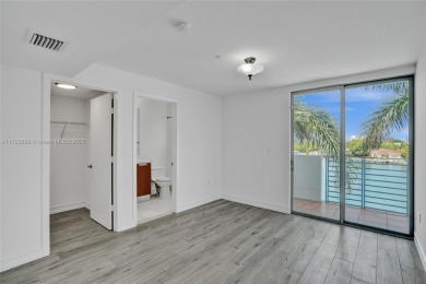 MOTIVATED SELLER!! Rare Bayfront Townhome with 30ft Boat Dock in on Normandy Shores Golf Course in Florida - for sale on GolfHomes.com, golf home, golf lot