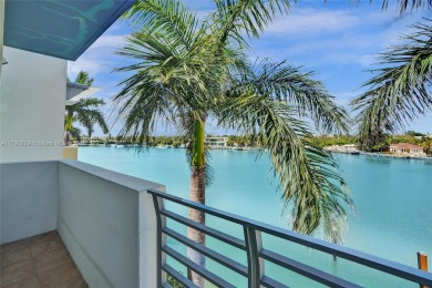 MOTIVATED SELLER!! Rare Bayfront Townhome with 30ft Boat Dock in on Normandy Shores Golf Course in Florida - for sale on GolfHomes.com, golf home, golf lot