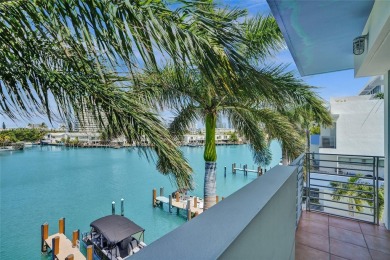 MOTIVATED SELLER!! Rare Bayfront Townhome with 30ft Boat Dock in on Normandy Shores Golf Course in Florida - for sale on GolfHomes.com, golf home, golf lot