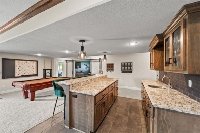 Welcome to this exceptional reverse 1.5-story walkout home in on Fred Arbanas Golf Course At Longview Lakes - Longview Lake in Missouri - for sale on GolfHomes.com, golf home, golf lot