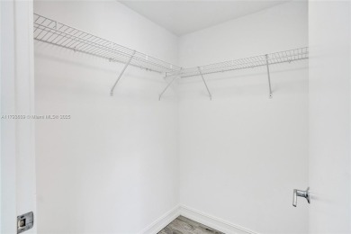 MOTIVATED SELLER!! Rare Bayfront Townhome with 30ft Boat Dock in on Normandy Shores Golf Course in Florida - for sale on GolfHomes.com, golf home, golf lot