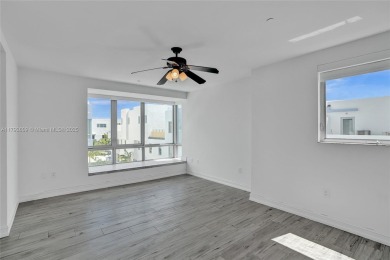 MOTIVATED SELLER!! Rare Bayfront Townhome with 30ft Boat Dock in on Normandy Shores Golf Course in Florida - for sale on GolfHomes.com, golf home, golf lot