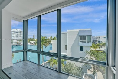 MOTIVATED SELLER!! Rare Bayfront Townhome with 30ft Boat Dock in on Normandy Shores Golf Course in Florida - for sale on GolfHomes.com, golf home, golf lot