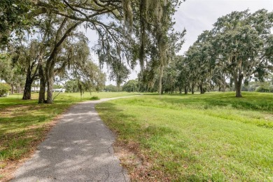 Tucked beneath the shade of moss-draped oaks and overlooking on Tarpon Woods Golf Club in Florida - for sale on GolfHomes.com, golf home, golf lot