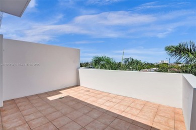 MOTIVATED SELLER!! Rare Bayfront Townhome with 30ft Boat Dock in on Normandy Shores Golf Course in Florida - for sale on GolfHomes.com, golf home, golf lot