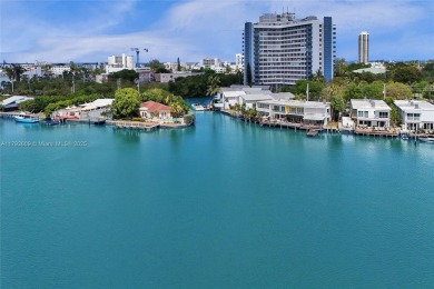 MOTIVATED SELLER!! Rare Bayfront Townhome with 30ft Boat Dock in on Normandy Shores Golf Course in Florida - for sale on GolfHomes.com, golf home, golf lot