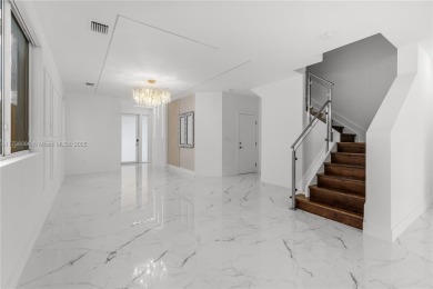 EXQUISITE TWO-STORY HOME IN THE HEART OF DORAL WITH STUNNING on Jim McLean Signature Course in Florida - for sale on GolfHomes.com, golf home, golf lot