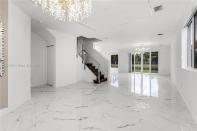 EXQUISITE TWO-STORY HOME IN THE HEART OF DORAL WITH STUNNING on Jim McLean Signature Course in Florida - for sale on GolfHomes.com, golf home, golf lot