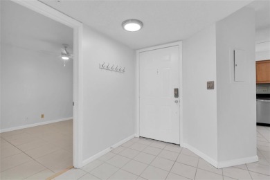 Newly painted two bedroom two full bath one level condo on the on Isla Del Sol Yacht and Country Club in Florida - for sale on GolfHomes.com, golf home, golf lot
