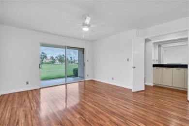 Newly painted two bedroom two full bath one level condo on the on Isla Del Sol Yacht and Country Club in Florida - for sale on GolfHomes.com, golf home, golf lot
