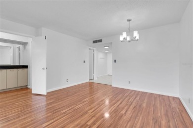 Newly painted two bedroom two full bath one level condo on the on Isla Del Sol Yacht and Country Club in Florida - for sale on GolfHomes.com, golf home, golf lot