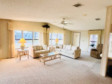 Welcome to this beautiful 2-bedroom, 2-bathroom home nestled in on Pine Lakes Country Club in Florida - for sale on GolfHomes.com, golf home, golf lot