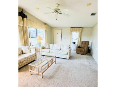 Welcome to this beautiful 2-bedroom, 2-bathroom home nestled in on Pine Lakes Country Club in Florida - for sale on GolfHomes.com, golf home, golf lot