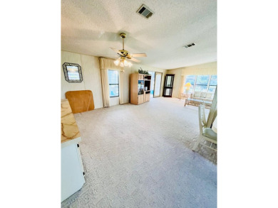 Welcome to this beautiful 2-bedroom, 2-bathroom home nestled in on Pine Lakes Country Club in Florida - for sale on GolfHomes.com, golf home, golf lot
