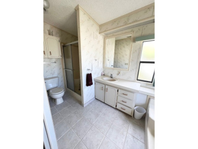 Welcome to this beautiful 2-bedroom, 2-bathroom home nestled in on Pine Lakes Country Club in Florida - for sale on GolfHomes.com, golf home, golf lot