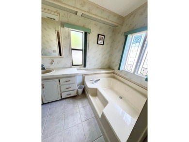 Welcome to this beautiful 2-bedroom, 2-bathroom home nestled in on Pine Lakes Country Club in Florida - for sale on GolfHomes.com, golf home, golf lot