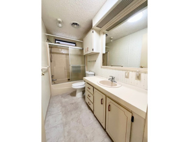 Welcome to this beautiful 2-bedroom, 2-bathroom home nestled in on Pine Lakes Country Club in Florida - for sale on GolfHomes.com, golf home, golf lot