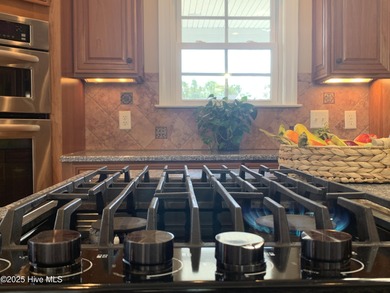 Southern Low-Country custom-built home sits in a quiet on Carolina National Golf Club in North Carolina - for sale on GolfHomes.com, golf home, golf lot