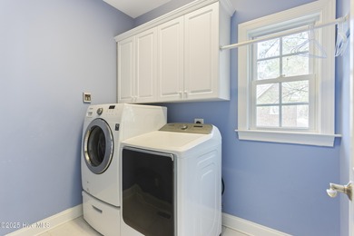 Southern Low-Country custom-built home sits in a quiet on Carolina National Golf Club in North Carolina - for sale on GolfHomes.com, golf home, golf lot