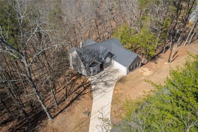 Welcome home to your own private mountainside retreat in Lake on The Highlands Course at Lake Arrowhead in Georgia - for sale on GolfHomes.com, golf home, golf lot