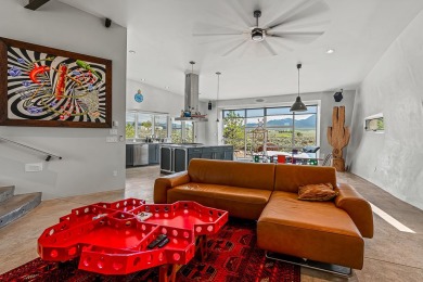 Live inside a work of art in this  Artist's Dream Dwelling in on Taos Country Club in New Mexico - for sale on GolfHomes.com, golf home, golf lot