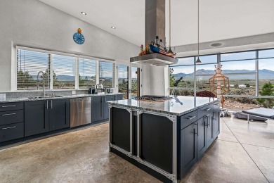 Live inside a work of art in this  Artist's Dream Dwelling in on Taos Country Club in New Mexico - for sale on GolfHomes.com, golf home, golf lot