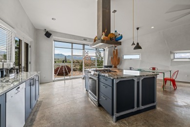 Live inside a work of art in this  Artist's Dream Dwelling in on Taos Country Club in New Mexico - for sale on GolfHomes.com, golf home, golf lot