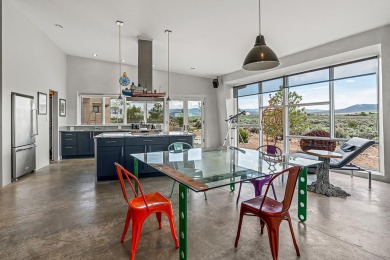 Live inside a work of art in this  Artist's Dream Dwelling in on Taos Country Club in New Mexico - for sale on GolfHomes.com, golf home, golf lot