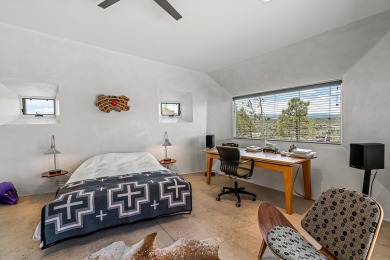 Live inside a work of art in this  Artist's Dream Dwelling in on Taos Country Club in New Mexico - for sale on GolfHomes.com, golf home, golf lot
