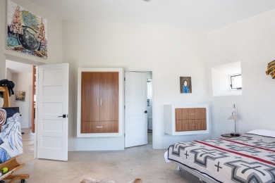 Live inside a work of art in this  Artist's Dream Dwelling in on Taos Country Club in New Mexico - for sale on GolfHomes.com, golf home, golf lot