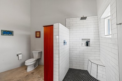 Live inside a work of art in this  Artist's Dream Dwelling in on Taos Country Club in New Mexico - for sale on GolfHomes.com, golf home, golf lot