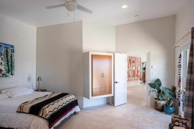 Live inside a work of art in this  Artist's Dream Dwelling in on Taos Country Club in New Mexico - for sale on GolfHomes.com, golf home, golf lot